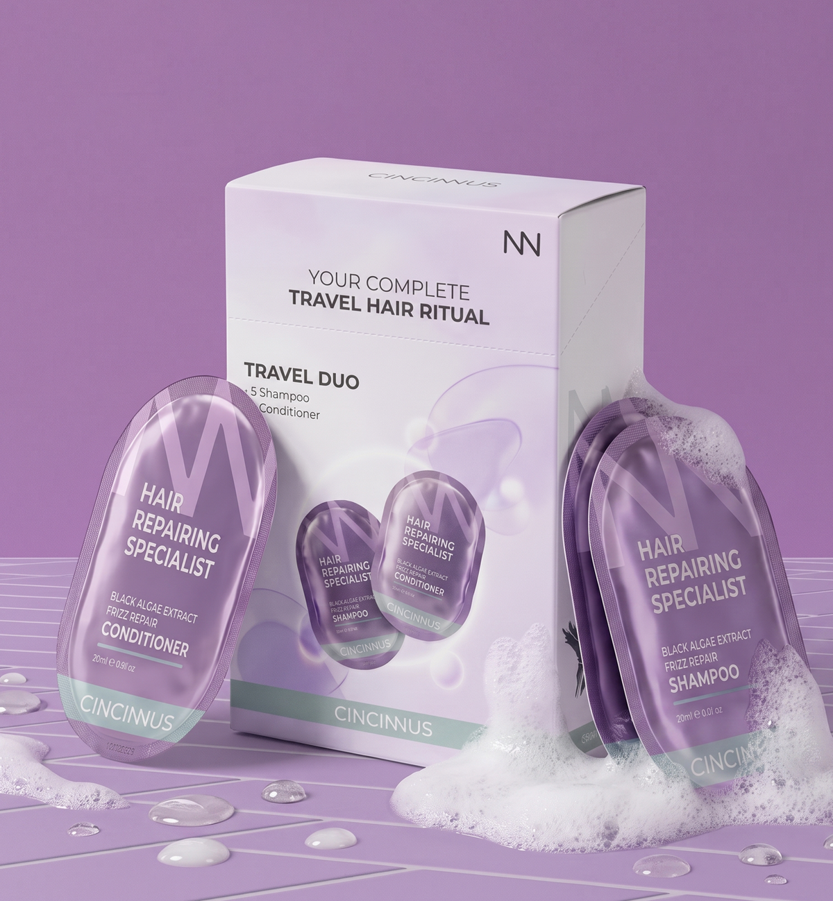CINCINNUS Travel Duo hair care set including a white box, a purple hair repairing specialist conditioner sachet, and a purple shampoo sachet, styled with white foam on a purple background.